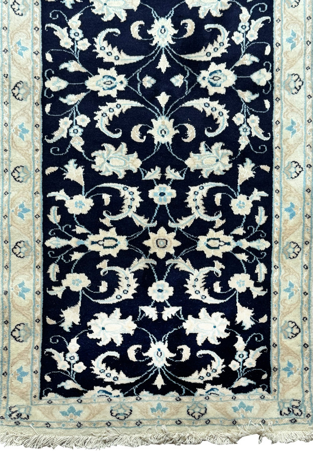 Close-up on the upper portion of the Persian Nain Runner, highlighting the intricate patterns and border design.