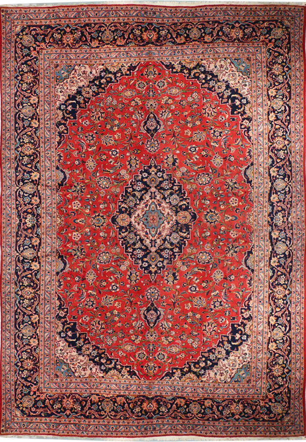 A front-facing image of a Persian Kashan rug laid flat, showing the entire pattern with a vibrant red field, central medallion, and intricate floral and geometric patterns in shades of blue, cream, and orange.