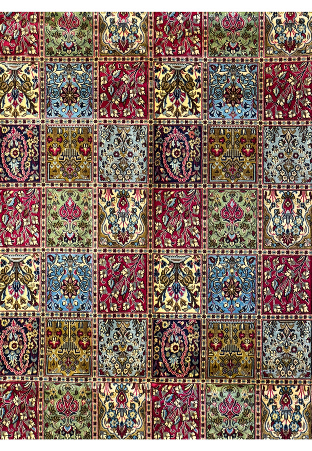 Close-up of the fine patterns and vibrant color mix in the panel design of a Persian Qum Kork rug, showcasing the craftsmanship and kork wool quality.
