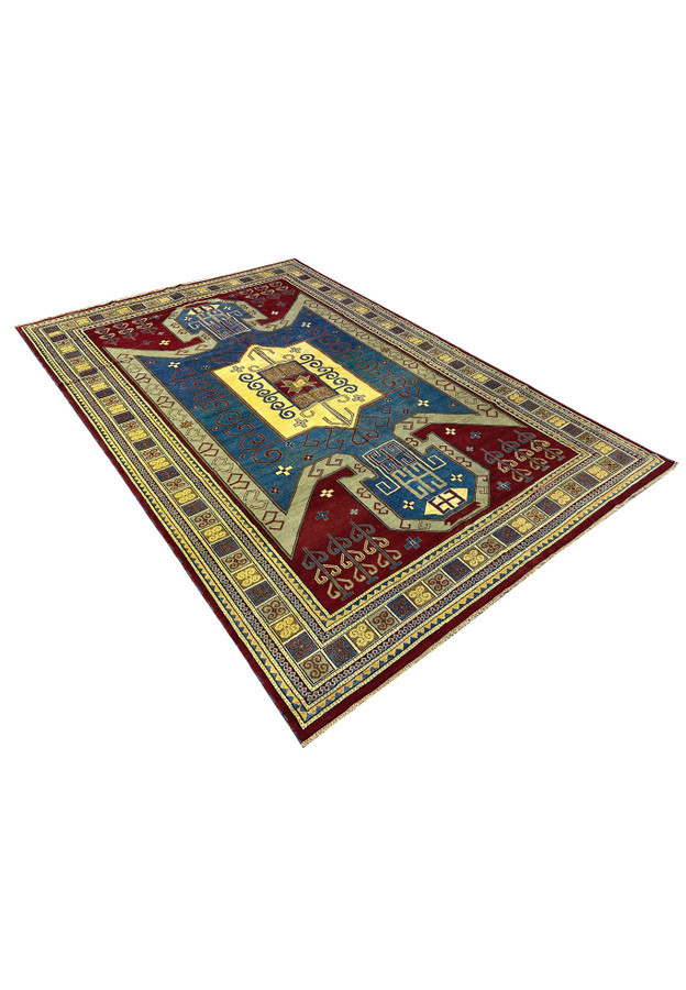 An angled view of the Kazak rug, emphasizing the texture and vibrant color contrast of the red, blue, yellow, and cream hues. The detailed patterns and quality of weaving can be seen clearly from this perspective.