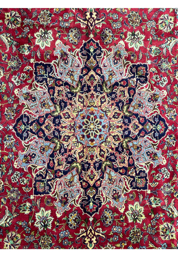 Mid-section of Persian Isfahan rug - Detailed view of the middle section of the Persian Isfahan rug, focusing on the symmetry and patterns of the design.