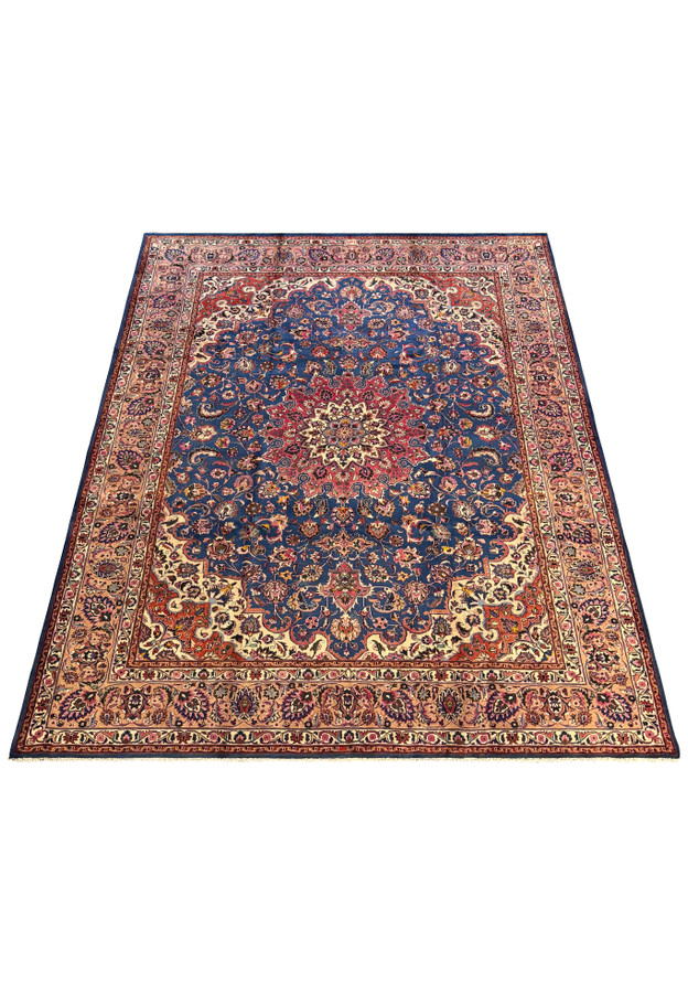 Full view of a Persian Mashad Rug with elaborate borders in pink, beige, and gold surrounding a vibrant central field.