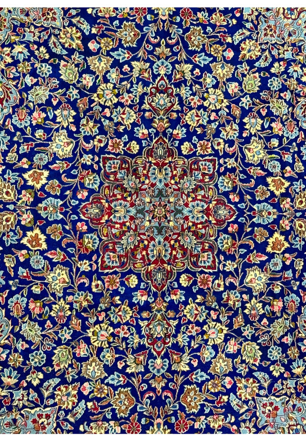 Close-up of the central medallion on a Persian Kerman Rug, displaying the intricate details and vibrant colors that make this rug a rare collector's item.