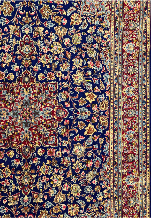Close-up of the right side border of a Persian Kerman Rug, emphasizing the intricate details and the vibrant, harmonious color scheme