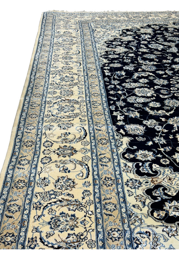 Complete side of the Nain wool and silk 13'2 x 19'4 Persian rug