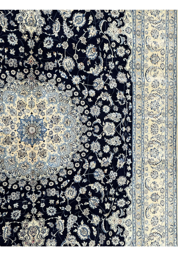 Edge and central field detail of the 13'2 x 19'4 Nain Persian rug