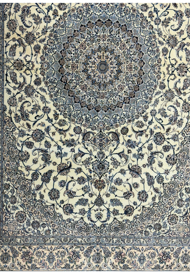 Detailed corner view of a 13 x 20 Persian Nain 9LAA Wool & Silk Rug showing floral and arabesque motifs
