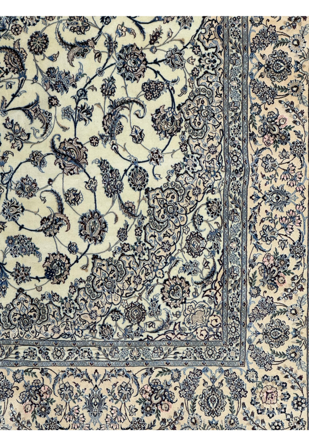 Corner section showcasing the border design of a Persian Nain 9LAA Wool & Silk Rug.