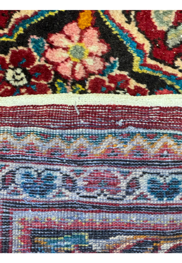 Underside view of a 10'7 x 13'5 Persian Mahal rug showcasing the cotton foundation.