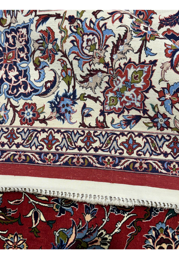 Close-up of border design and fringe on the back of Persian Isfahan Silk Seirafian Rug.