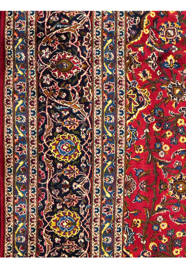 Side view of the Persian Kashan Rug emphasizing the intricate border design and vibrant colors.