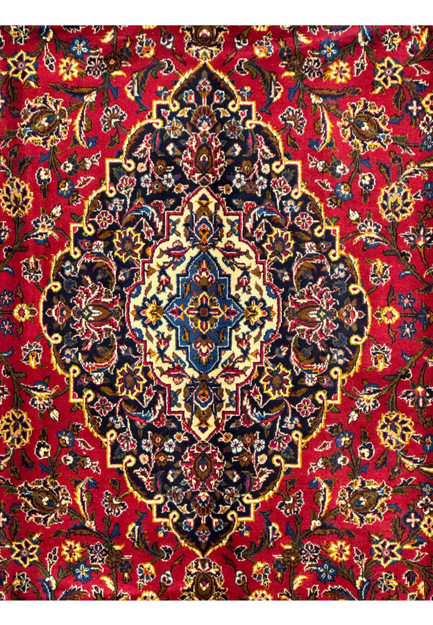 Close-up of the central medallion on the Persian Kashan Rug, showcasing intricate floral and geometric motifs.