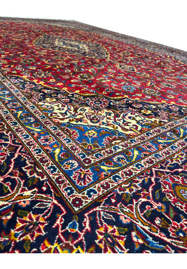 Angled view of the Persian Kashan Rug, highlighting the detailed motifs and luxurious colors.