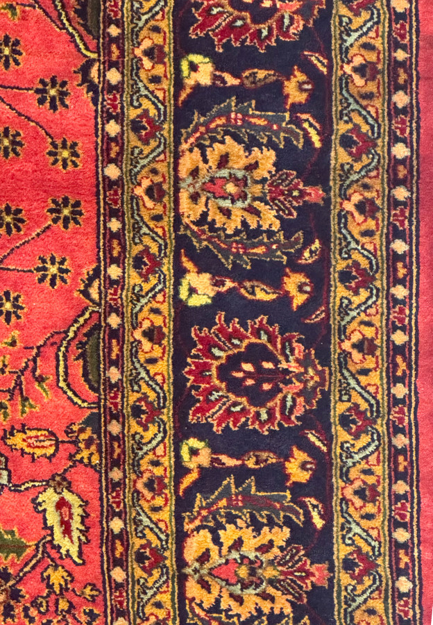 Detailed view of the fringe and border on the 6'5 x 9'6 American Sarough Rug.