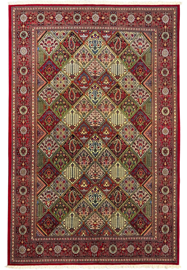 Hand-knotted 6'8 x 10 Persian Qum rug with intricate floral and geometric patterns, featuring rich red, beige, green, and blue colors