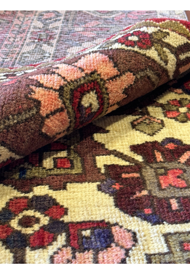 Rolled up the rug to see the fine tribal weaving technique and zoomed into the coloring.