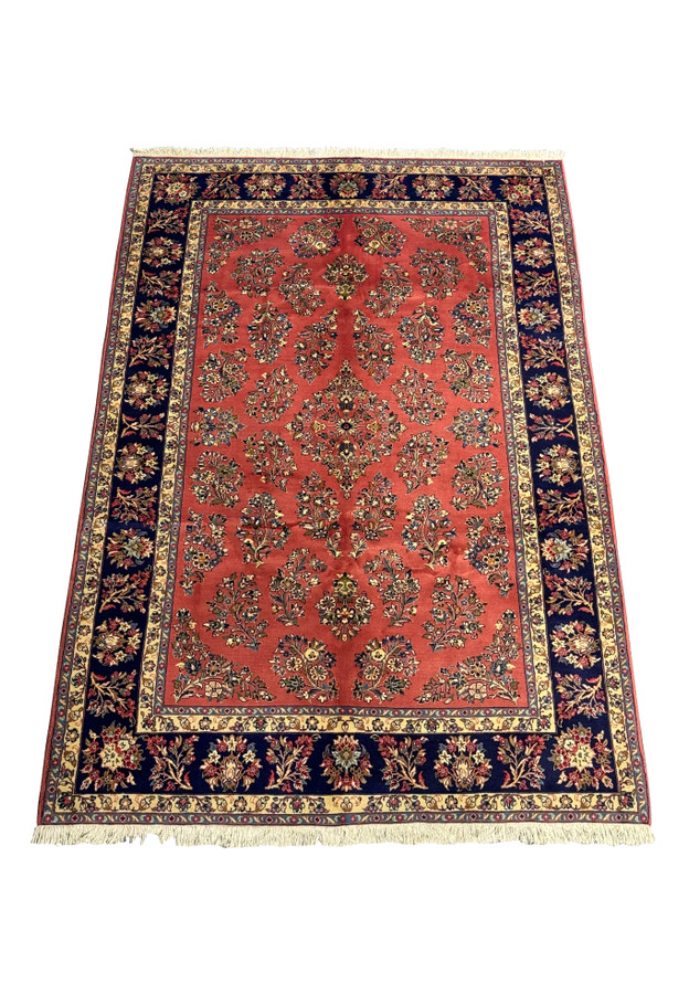 Full view of 6'9 x 9'8 Persian Yazd rug with detailed floral and vine motifs.