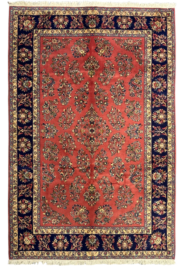 6'9 x 9'8 Persian Yazd rug with rich red field and intricate floral designs.