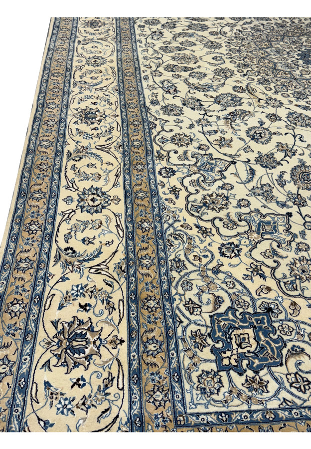 Detailed patterns and luxurious finish of a Persian Nain 9LA Rug