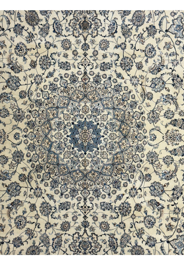 Detailed view of the central medallion design on a Persian Nain 9LA Wool & Silk Rug