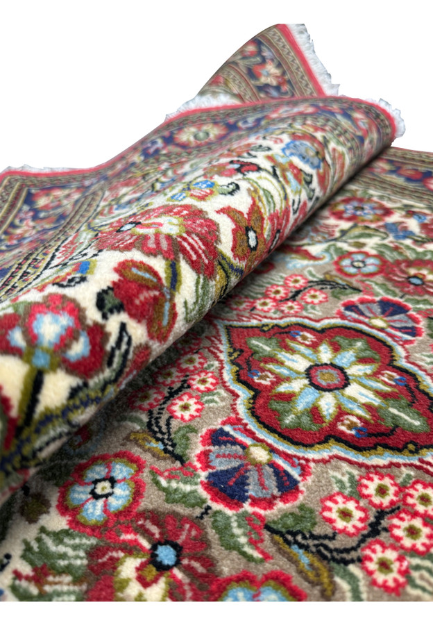 Side view showing the detailed patterns of a Persian Qum Kork ru
