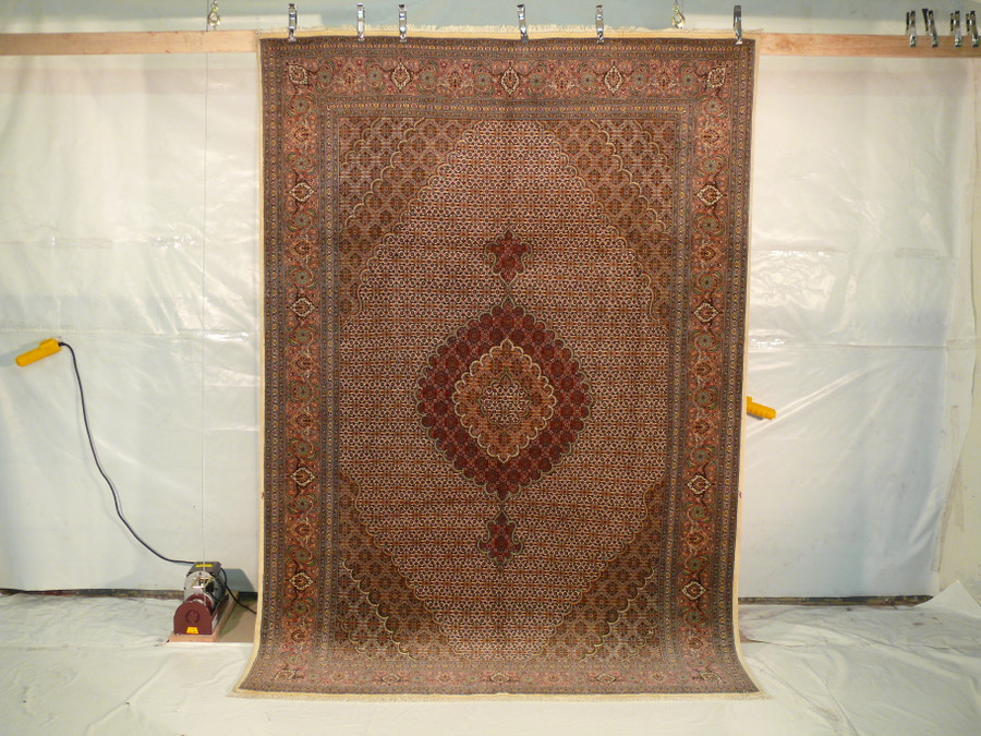 Hanging view of the 6'6" x 9'9" Tabriz Mahi Silk Rug illustrating its overall design and intricate patterns.