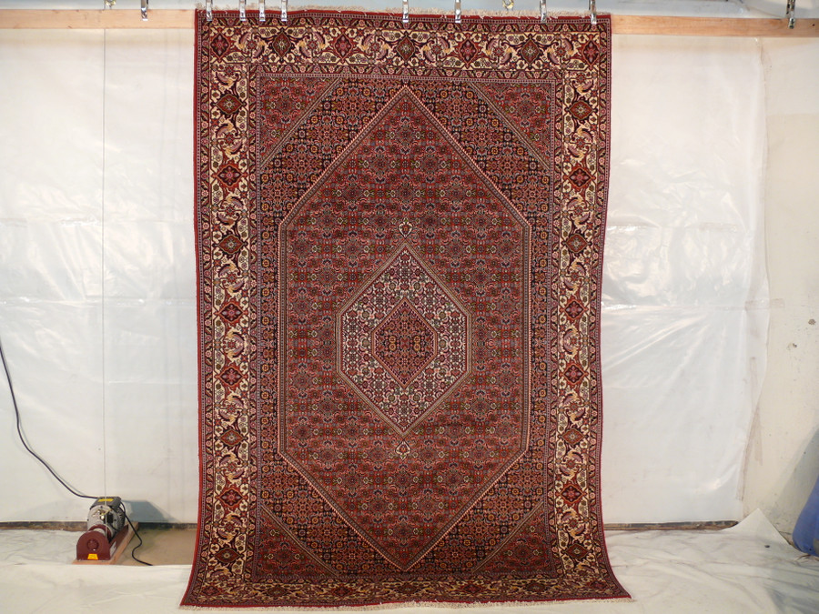 6'6 x 10'2 Bijar Persian Rug with intricate central medallion, hanging view