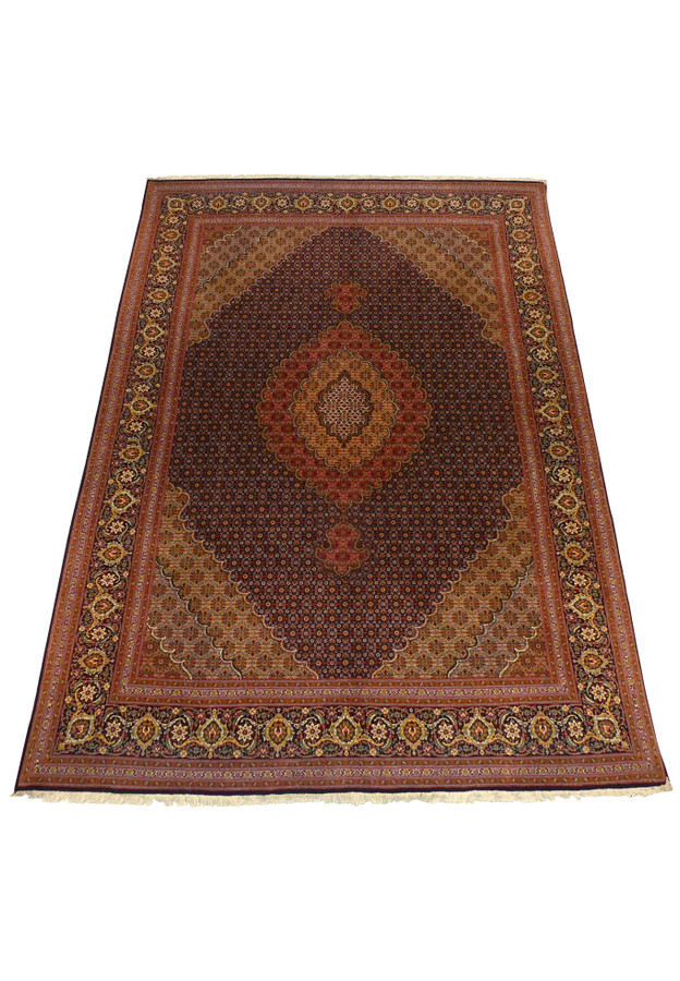 Laid down view of 6'8" x 9'7" Persian Tabriz Mahi 50 Raj Rug with detailed border and central medallion.