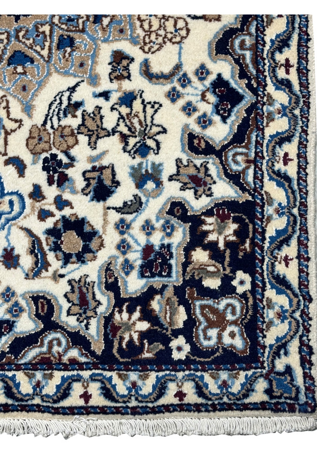 Detailed view of the border of a 3 x 4'5 Nain Persian Rug.