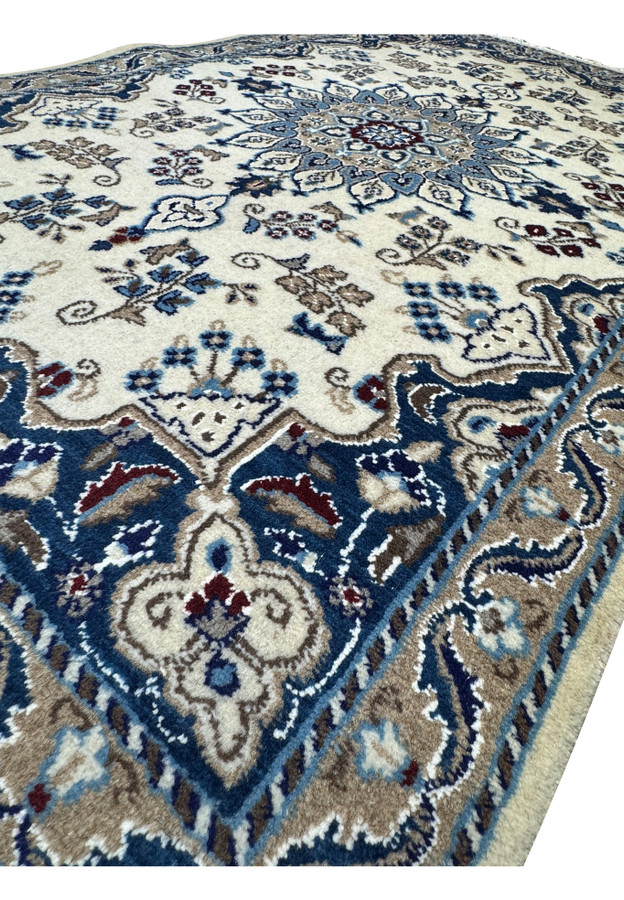 Angled view of a 2'10 x 4'8 Persian Nain Rug emphasizing the detailed design.