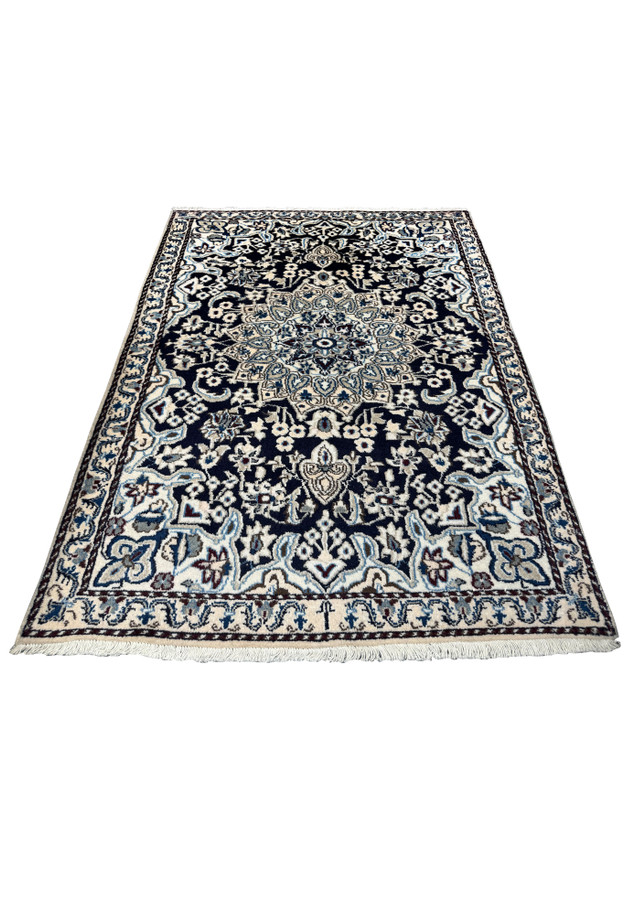 Laid down view of the 3x5 Persian Nain rug showcasing its detailed design.