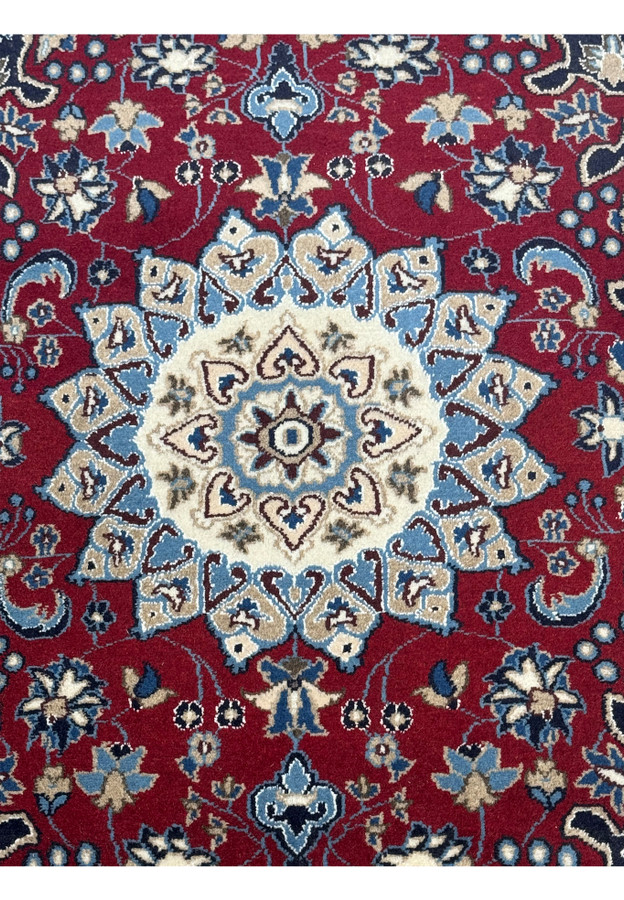 The 2'10" x 4'5" Red Persian Nain Rug laid down, showing the central medallion and symmetrical floral patterns.