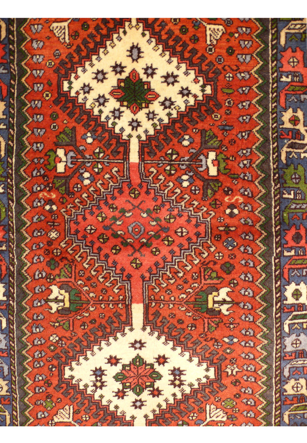 Central medallion detail on a 2'8 x 6'3 Persian Yalameh Runner showcasing traditional patterns