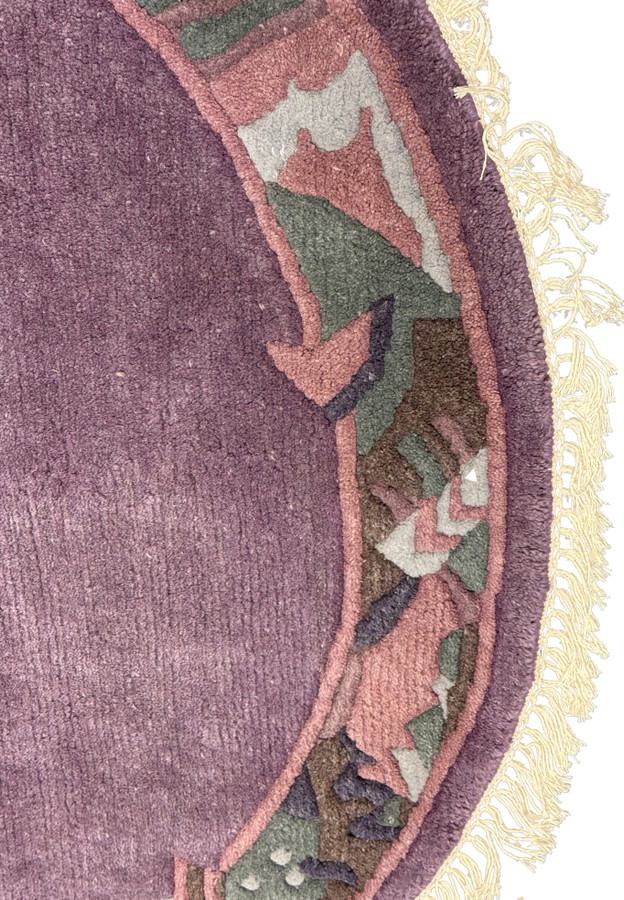 Close-up of the cream fringes and the edge of the 4'8 x 4'8 Nepalese rug, highlighting the craftsmanship.