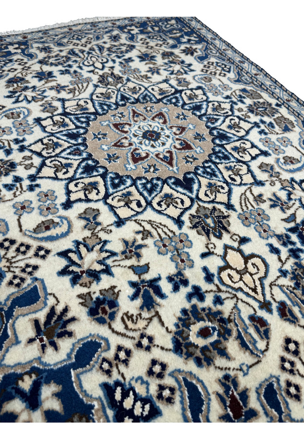 Angled view of the 2'11 x 4'5 Persian Nain rug, emphasizing its intricate patterns and luxurious texture