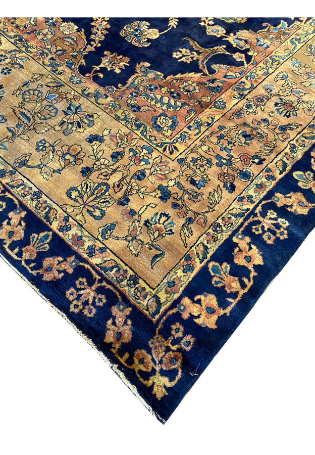 Side view of the Persian Kerman Lavar rug highlighting the detailed border design