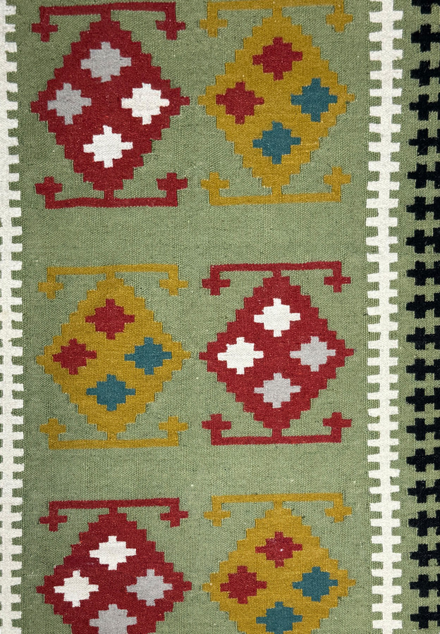 Close-up of the geometric patterns in the Persian Kilim Rug