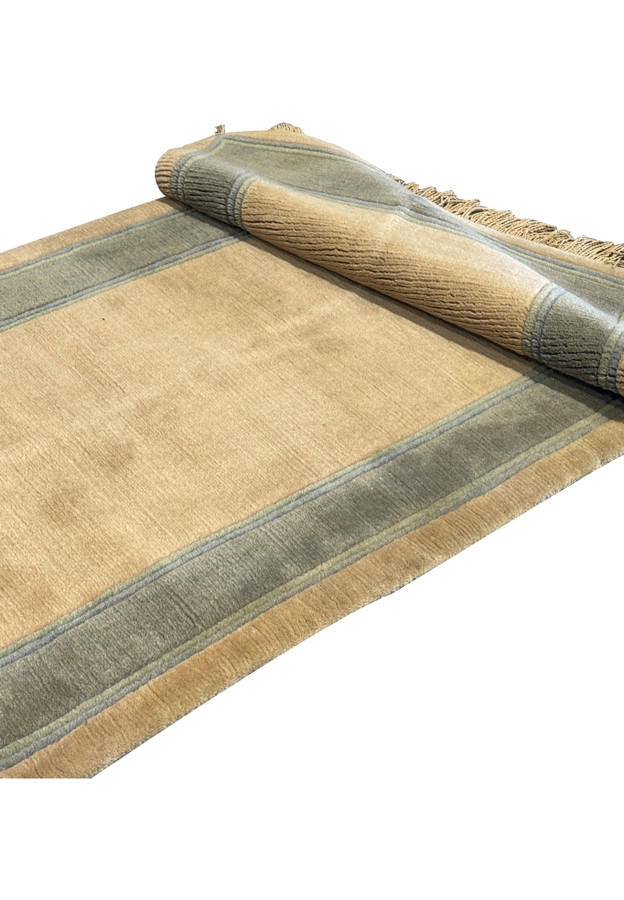 Rolled texture detail of a 2'8" x 28' Nepali runner showing fabric quality.