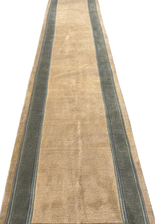 Angled view of long 2'8" x 28' Nepali runner highlighting its clean design."