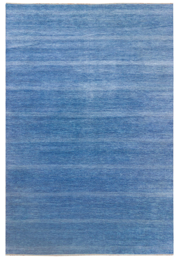 Full view of the blue 12x18 hand-knotted rug on display