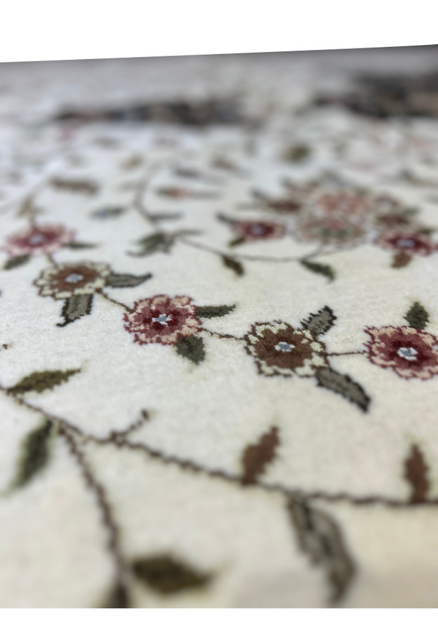 Close view of the floral and botanical motifs on a 12'5" x 18' Persian Tabriz Rug, demonstrating the artistry and detail in the design