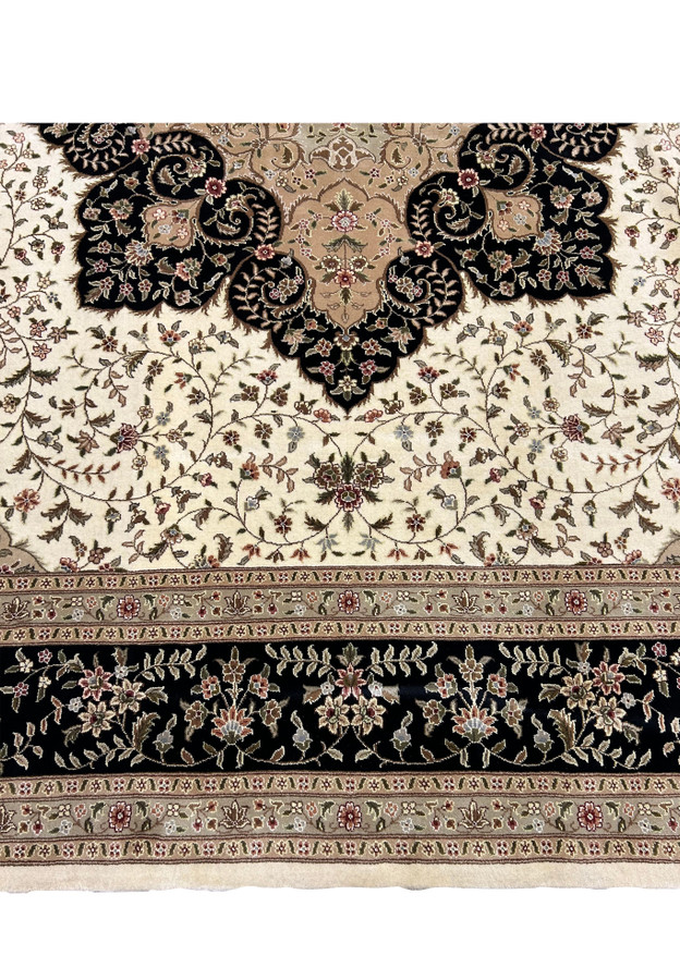 Lower border detail of a 12'5" x 18' Persian Tabriz Rug, highlighting the symmetry and color balance in the traditional designs