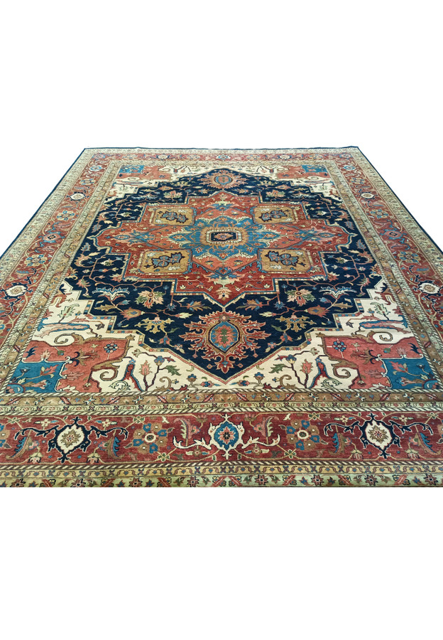 Laid down view of 12x15 Serapi Oriental Rug in room setting.