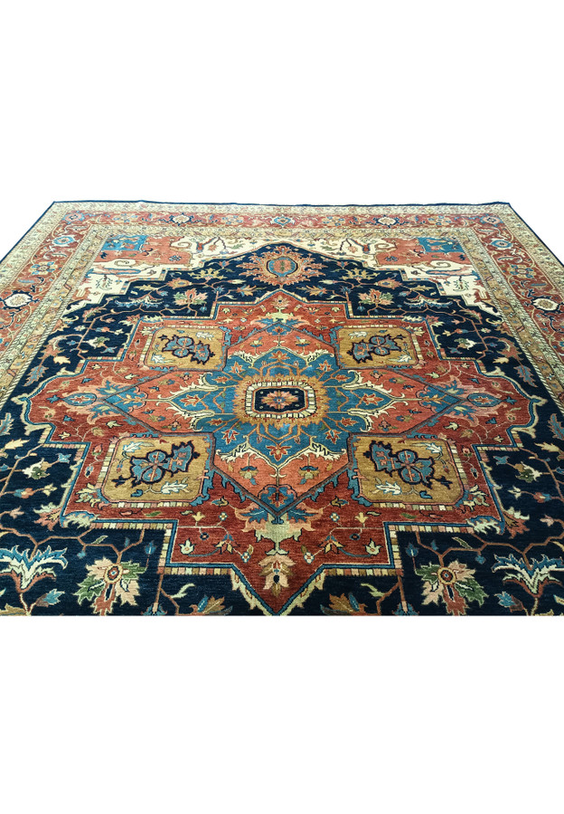 Upper part of 12x15 Serapi Oriental Rug with intricate designs.