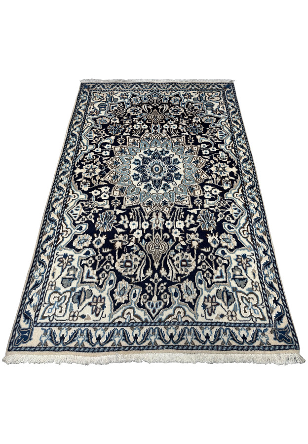3x5 Nain Persian rug displayed flat, highlighting its detailed craftsmanship.
