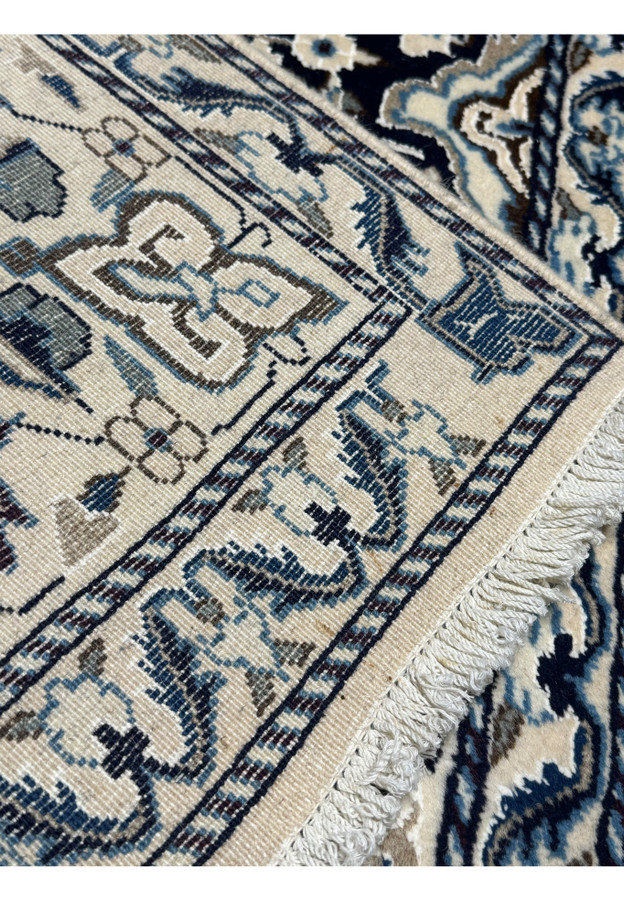 Backside view of a 3x5 Nain Persian rug revealing the weave quality and structure.