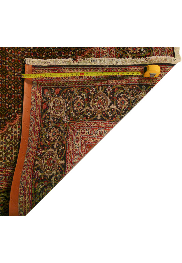 Backside of a 6'6 x 10'3 Persian Tabriz Mahi rug showing the weave quality.
