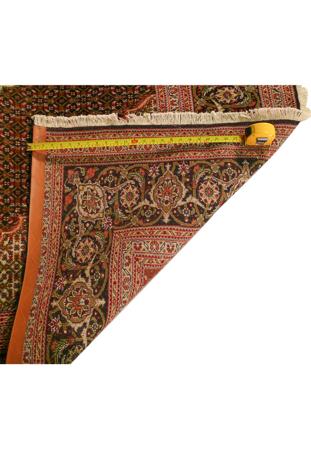 Zoomed view of the backside of a 6'6 x 10'3 Persian Tabriz Mahi rug to show texture.