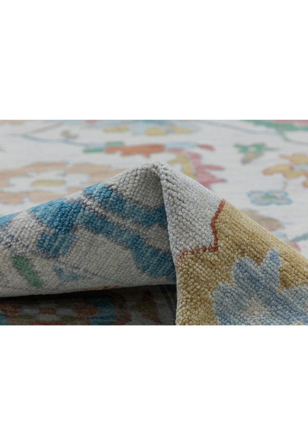 Texture detail of Oushak rug, emphasizing soft pastel hues.