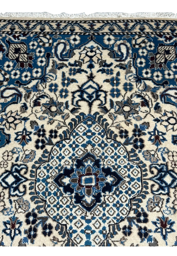 Midfield of the 2'9 x 4'7 Persian Nain Rug with intricate patterns.